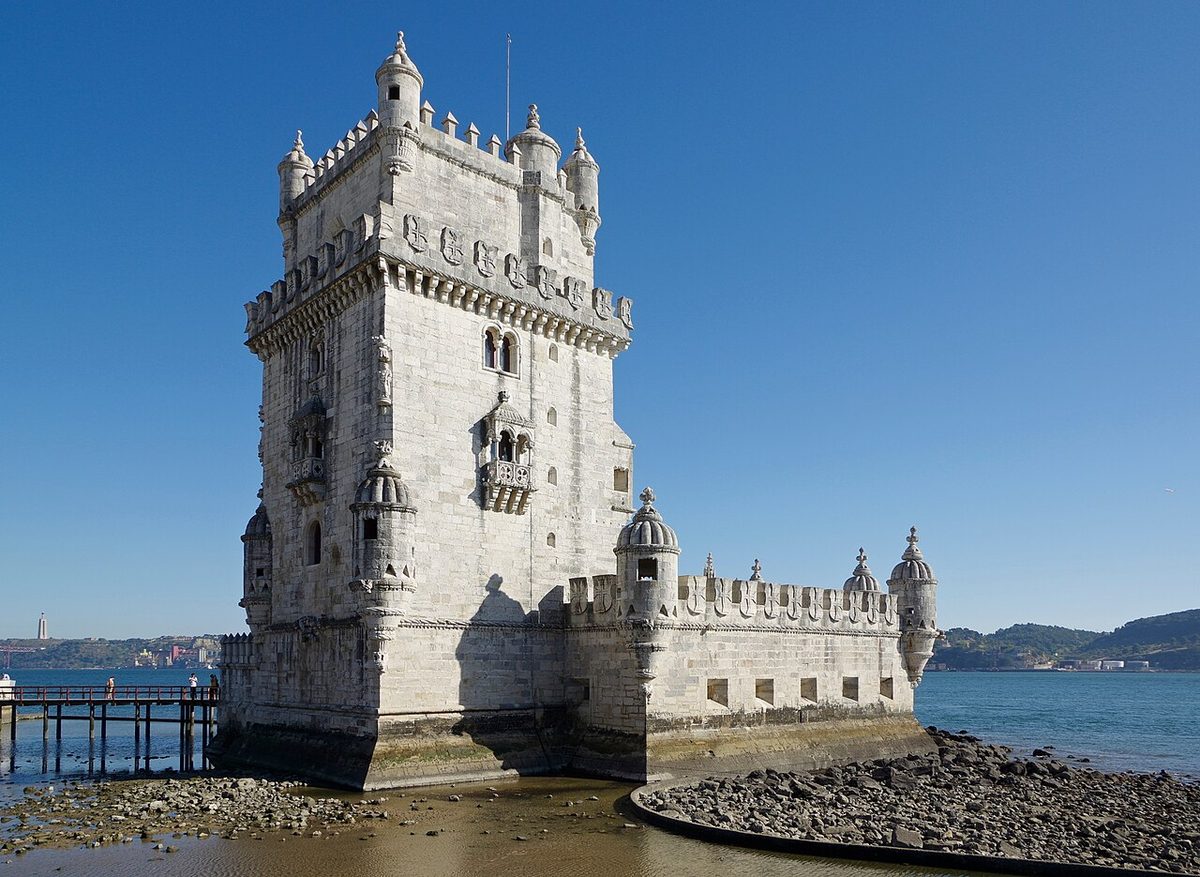 The Torre de Belém standing on its rock in the Tagus at low tide